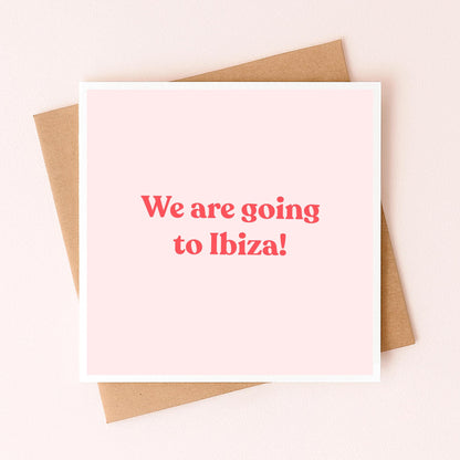 Greeting card front with red text: We are going to Ibiza!, pink with kraft backing