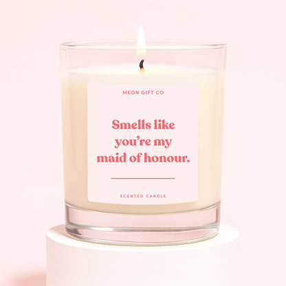 Scented candle in clear glass jar with cream wax, label 'Smells like you're my maid of honour.'